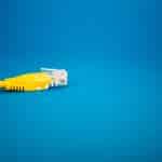 a yellow ethernet cable on a blue background